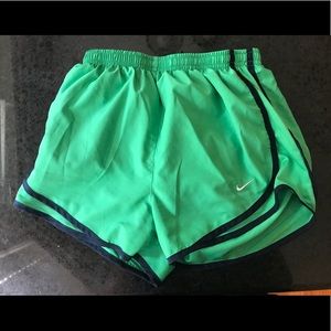 Green and navy Nike shorts